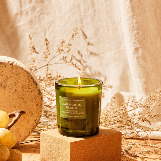 Rewined Signature Sauvignon Blanc candle, 10 oz, lit